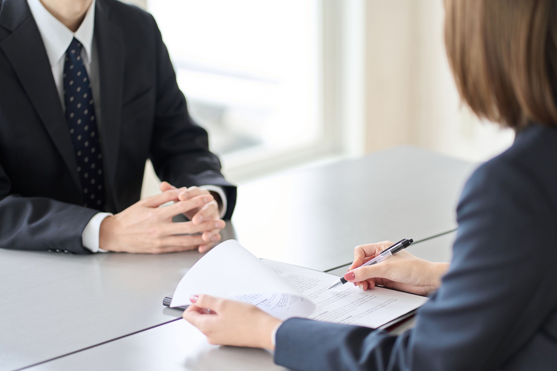 Hands of a woman conducting a business interview